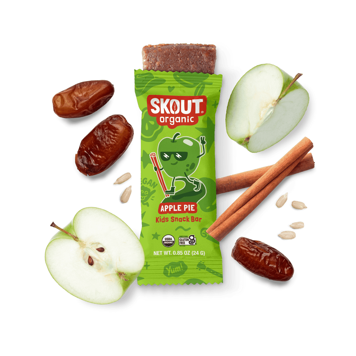 Skout Organic Apple Pie Kids Snack Bar in an open wrapper, surrounded by dates, apples, and cinnamon sticks.