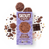 Skout Organic Double Chocolate Soft-Baked Cookies in an open box, surrounded by cocoa powder and chocolate chips.