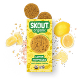 Skout Organic Lemon Poppyseed Soft-Baked Cookies in an open box, surrounded by lemon slices and poppy seeds.