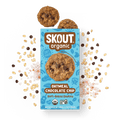 Skout Organic Oatmeal Chocolate Chip Soft-Baked Cookies in an open box, surrounded by oats and chocolate chips.