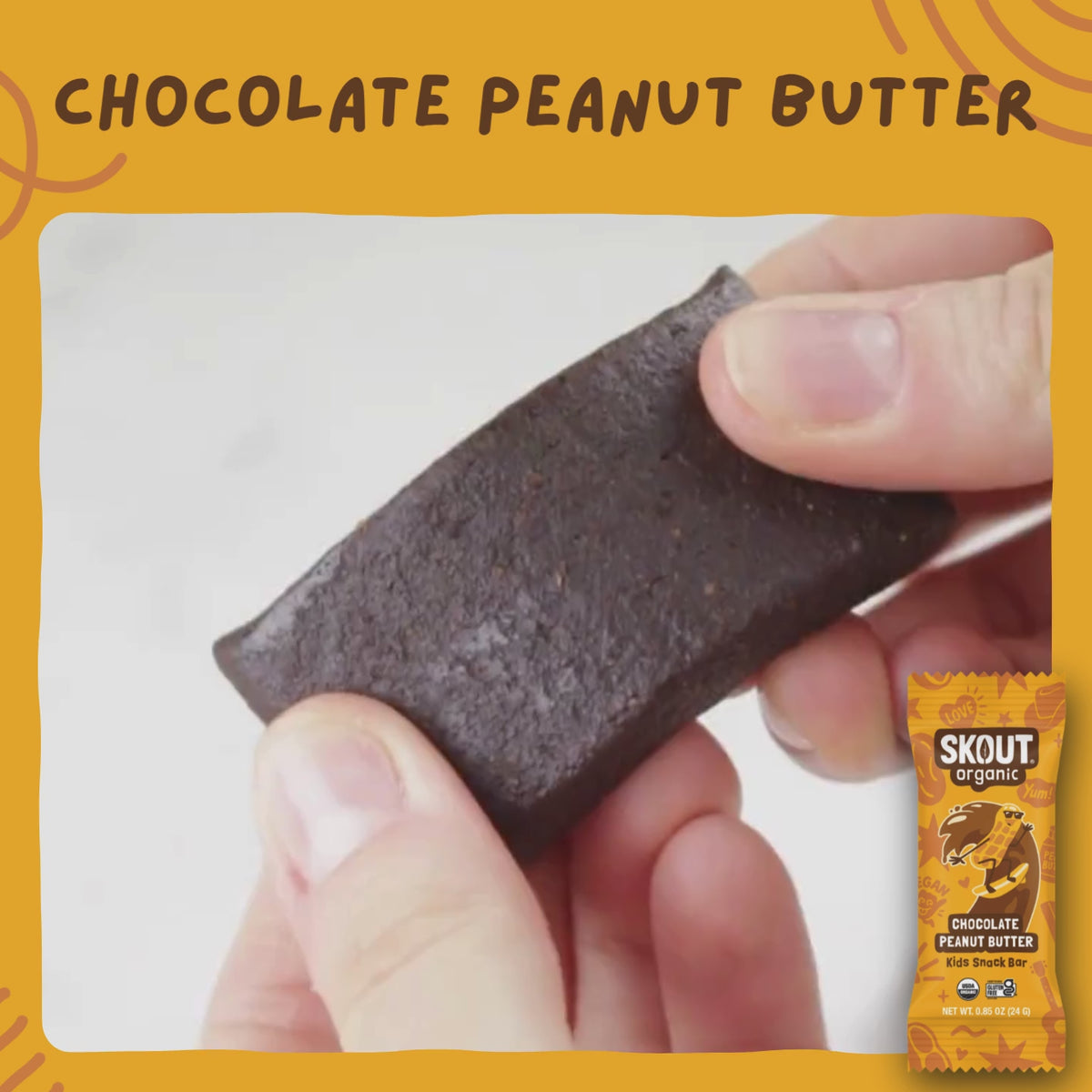 Close-up of a Chocolate Peanut Butter Kids Snack Bar being pulled apart to show its soft, chewy interior.